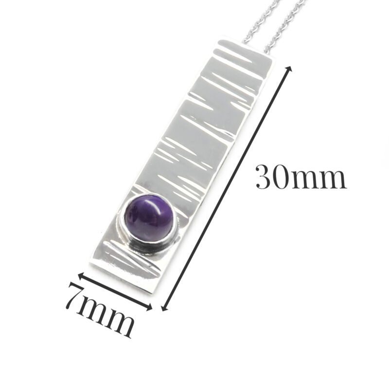 B214-sterling silver and Amethyst pendant. Measures 30x7mm with 5mm gemstone