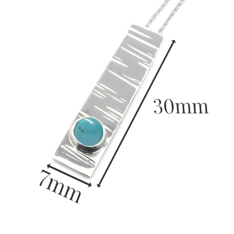 B214-sterling silver and Turquoise pendant. Measures 30x7mm with 5mm gemstone