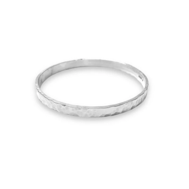 Sterling silver bangle with dimple texture. Available in 4 sizes.