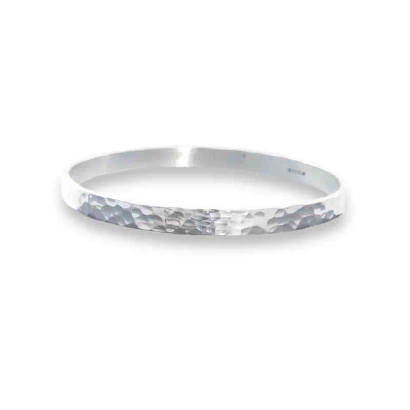 Sterling silver bangle with dimple texture. Available in 4 sizes.