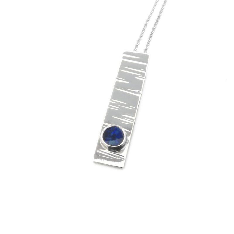 B214-sterling silver and opa doublet pendant. Measures 30x7mm with 5mm gemstone
