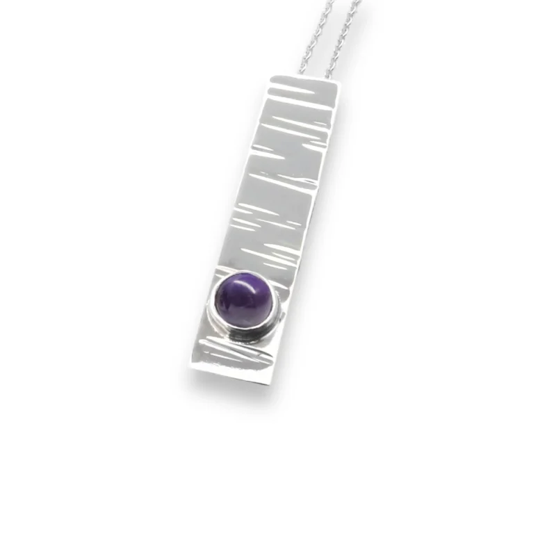 Sterling silver and 5mm Amethyst pendant featuring the bark texture. This pendant comes complete with a 16-18″ sterling silver chain.