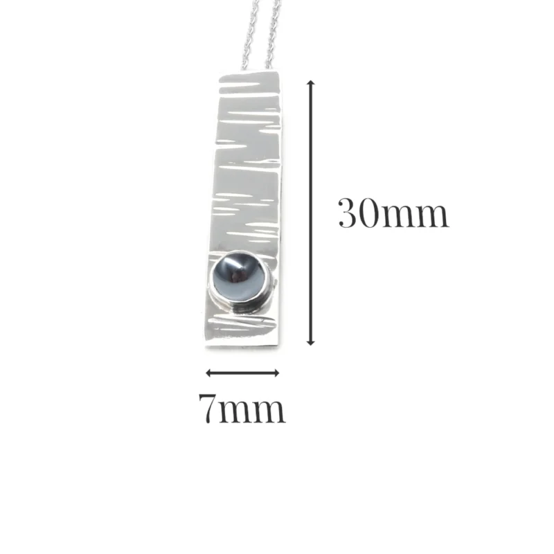 Sterling silver and 5mm Hematite pendant featuring the bark texture. This pendant comes complete with a 16-18″ sterling silver chain.