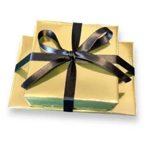 Order gift wrapped in gold wrapping paper with a black ribbon