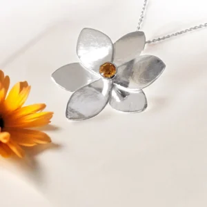 Sterling silver and 7mm Citrine daffodil pendant on a sterling silver chain.