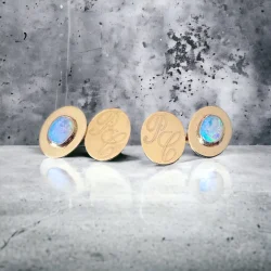Sterling silver cufflinks set with clients opals, engraved with the clients initials and gold plated.